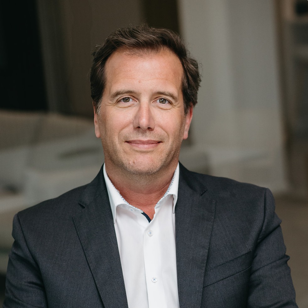 Michael Becker, partner at FORCYD, wearing a suit